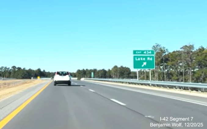 Image of ground mounted ramp sign for the Lake Road exit prior on US 70 (Future 
	I-42) West Havelock Bypass, Screen grab from Benjamin Wolf video, December 2025