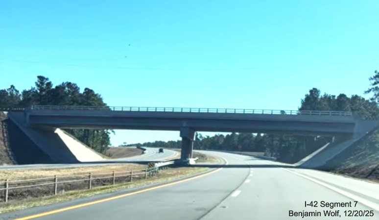 Image of driving under the new Lake Road bridge on US 70 (Future I-42) East 
	Havelock Bypass, Screen grab from Benjamin Wolf video, December 2025