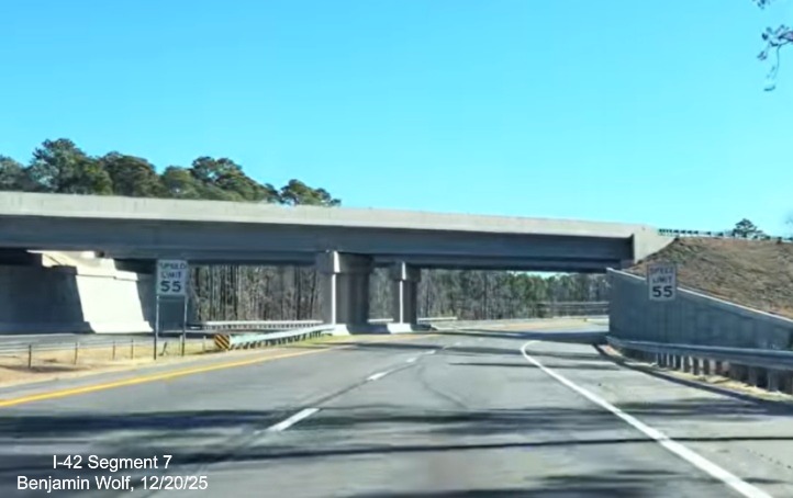 Image of Speed Limit 55 signs prior to passing under the Business US 70 East 
	bridge at the end of the US 70 (Future I-42) East Havelock Bypass, Screen grab from Benjamin Wolf video, December 2025