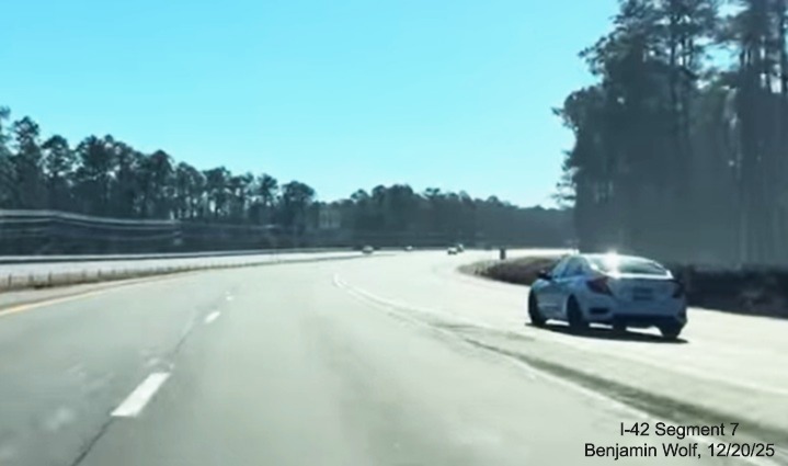 Image of merging with Business US 70 East traffic at the end of the US 70 (Future 
	I-42) East Havelock Bypass, Screen grab from Benjamin Wolf video, December 2025