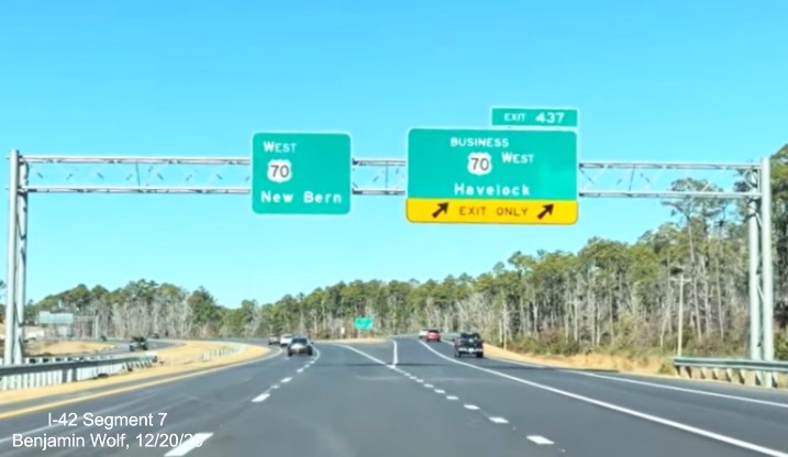 Image of overhead signage at the Business US 70 West exit at the start of the US 70 
	(Future I-42) West Havelock Bypass, Screen grab from Benjamin Wolf video, December 2025