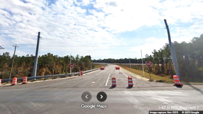 Image of future exit ramp from Future I-42 Havelock Bypass West to Lake Road, partially
	blocked off, Google Maps Street View, November 2025