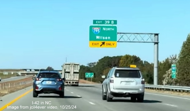 Image of renumbered exit sign for I-795 North exit on I-42 West/Goldsboro Bypass, from jcil4ever video,
October 2024