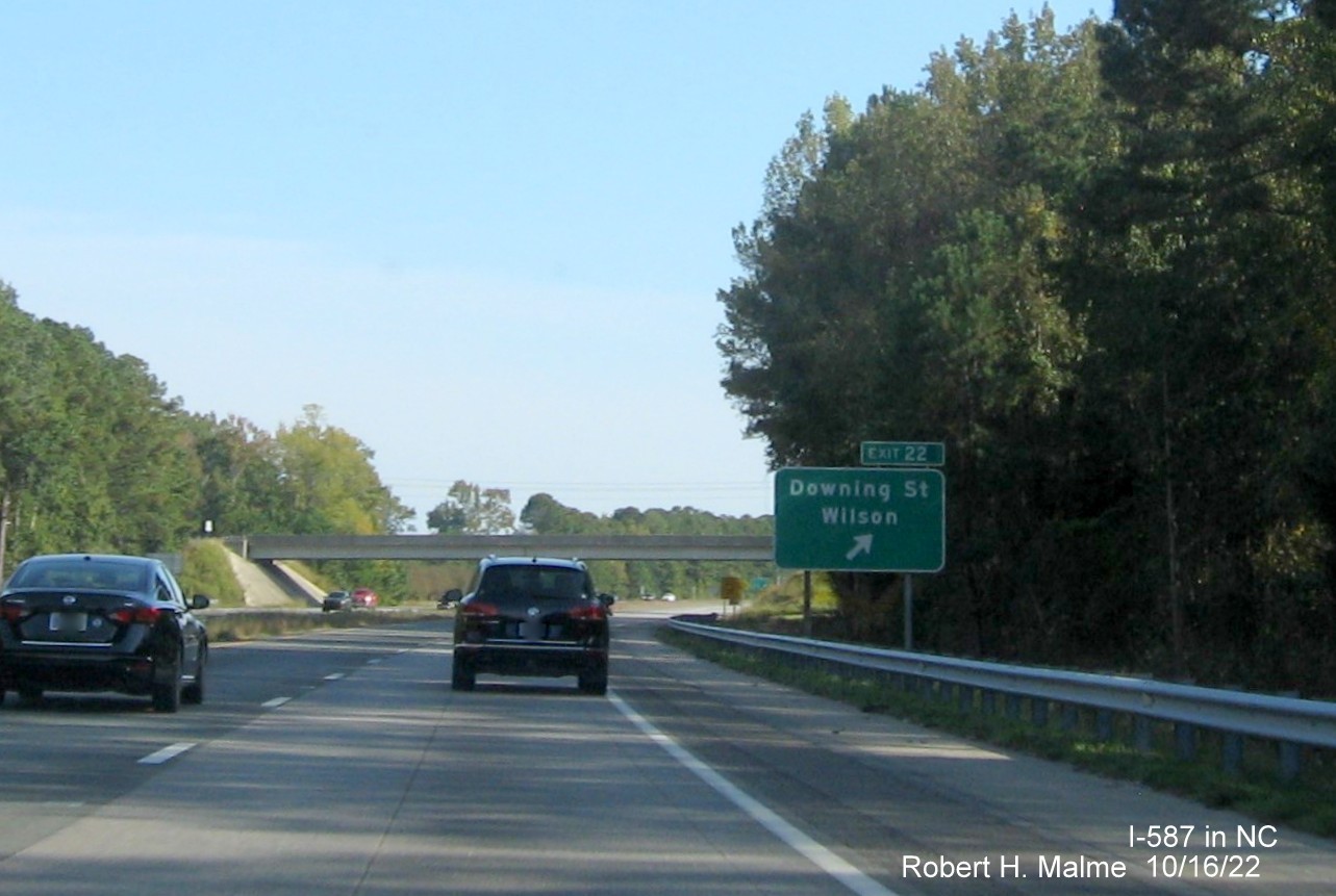 Image of exit sign for Downing Street exit with new I-587 milepost exit number on I-587/US 264 East,I-795 
                                        South in Wilson, October 2022