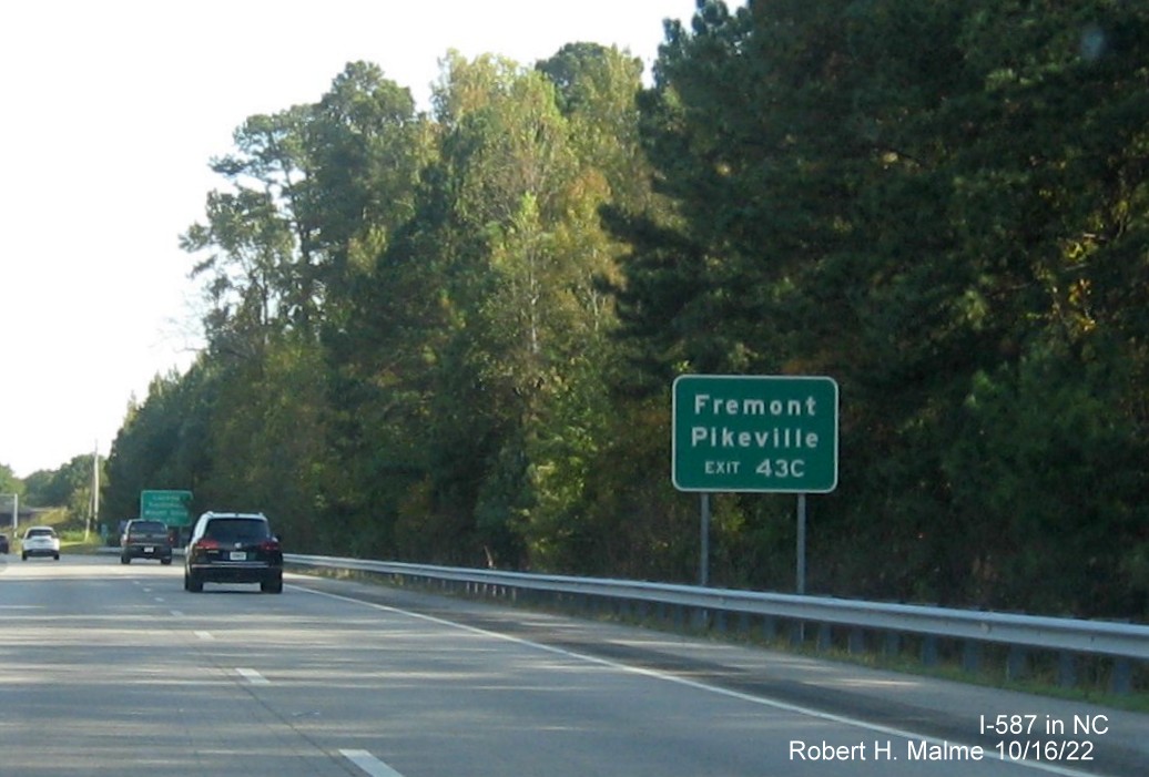 Image of auxilary sign for I-795 South exit still with US 264 milepost exit number on I-587/US 264 East,I-795 
                                        South in Wilson, October 2022