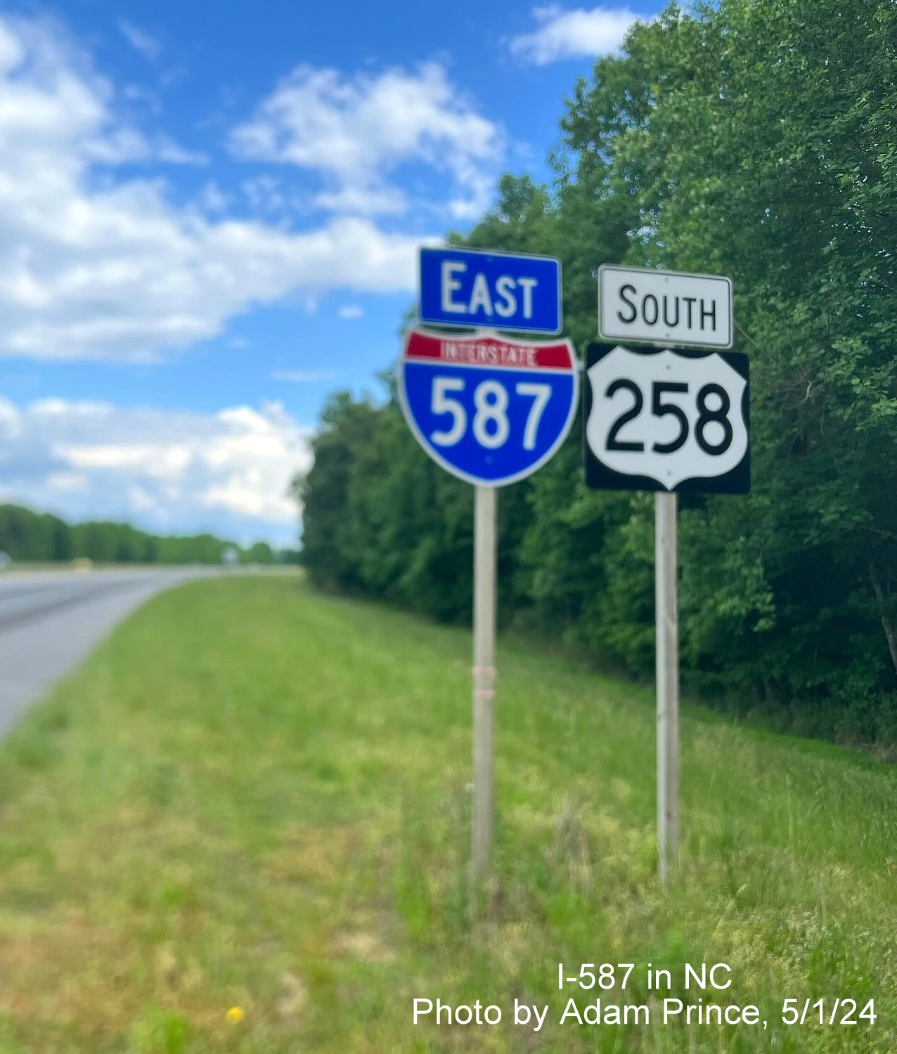 Image of East I-587 reassurance marker in Farmville now with correct blue banner, 
	by Adam Prince, May 2024