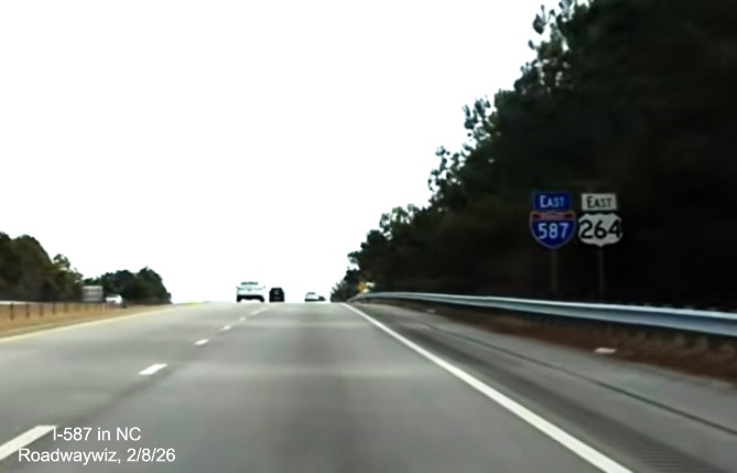 Image of East I-587 reassurance marker, now with blue direction tab, after US 301 exit
	 in Wilson, screen grab from Roadwaywiz video, February 2026