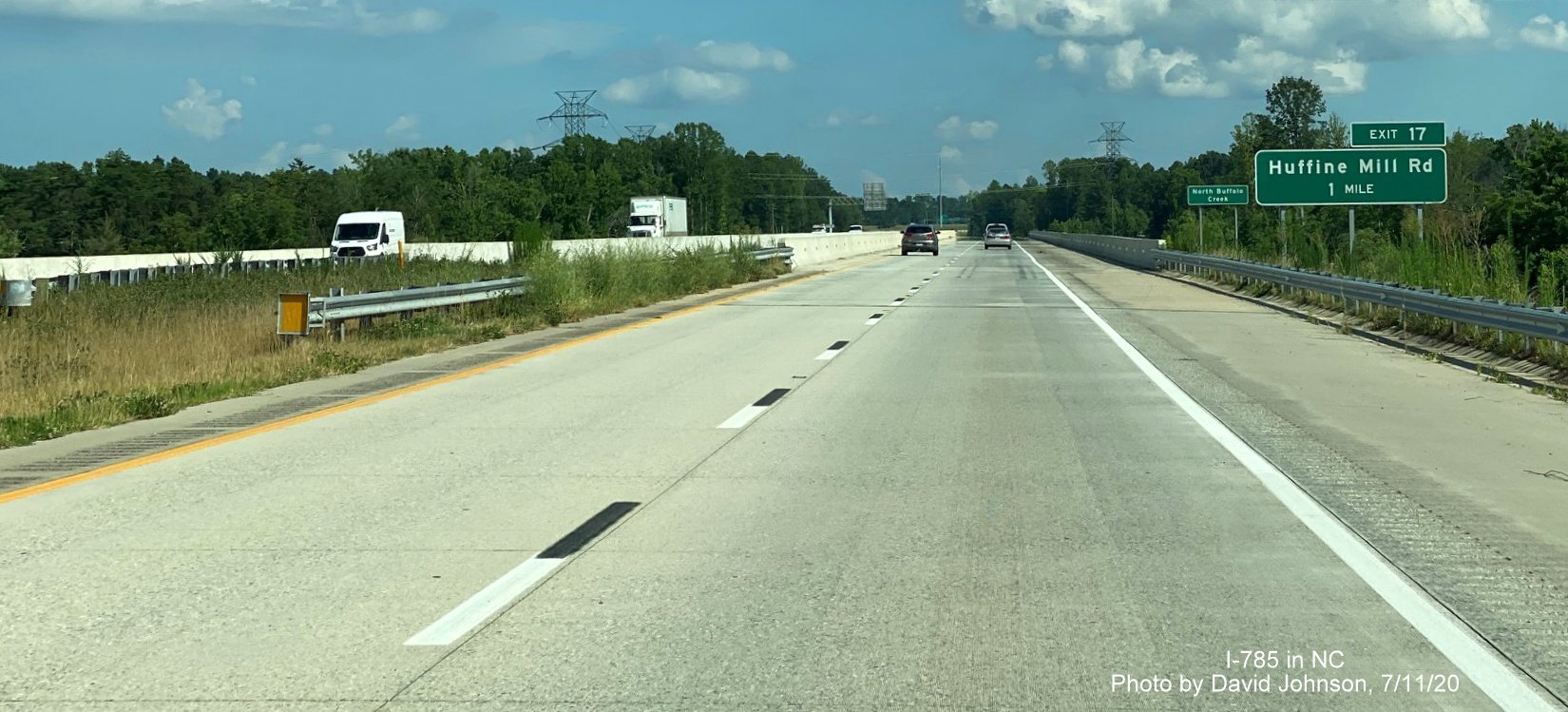 Image of ground mounted 2-miles advance sign for Huffine Mill Road on I-785 South/Greensboro Urban Loop, by David Johnson July 2020