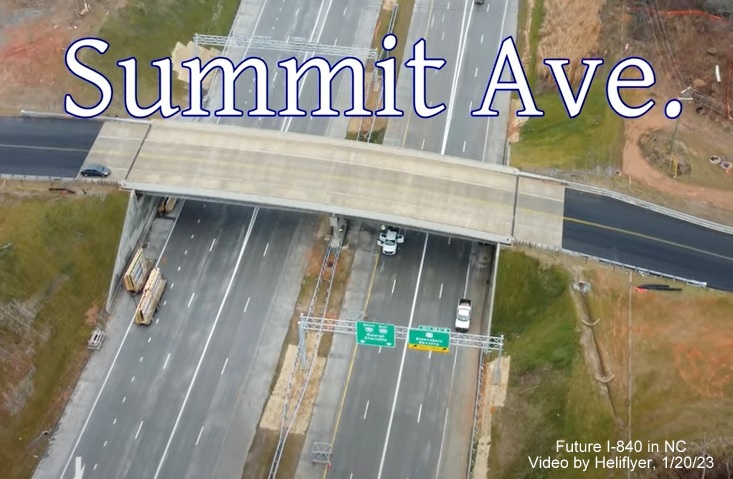 Image from Heliflyer video showing newly installed overhead gantry with I-785 South/I-840 East pull through sign, January 2023
