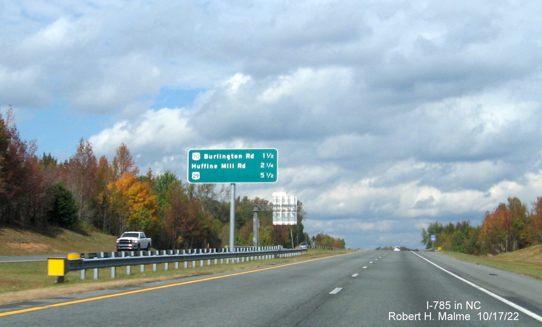 Image of overhead median post-interchange distance sign on I-785 North (Future I-840 West) Greensboro 
                  Urban Loop, October 2022