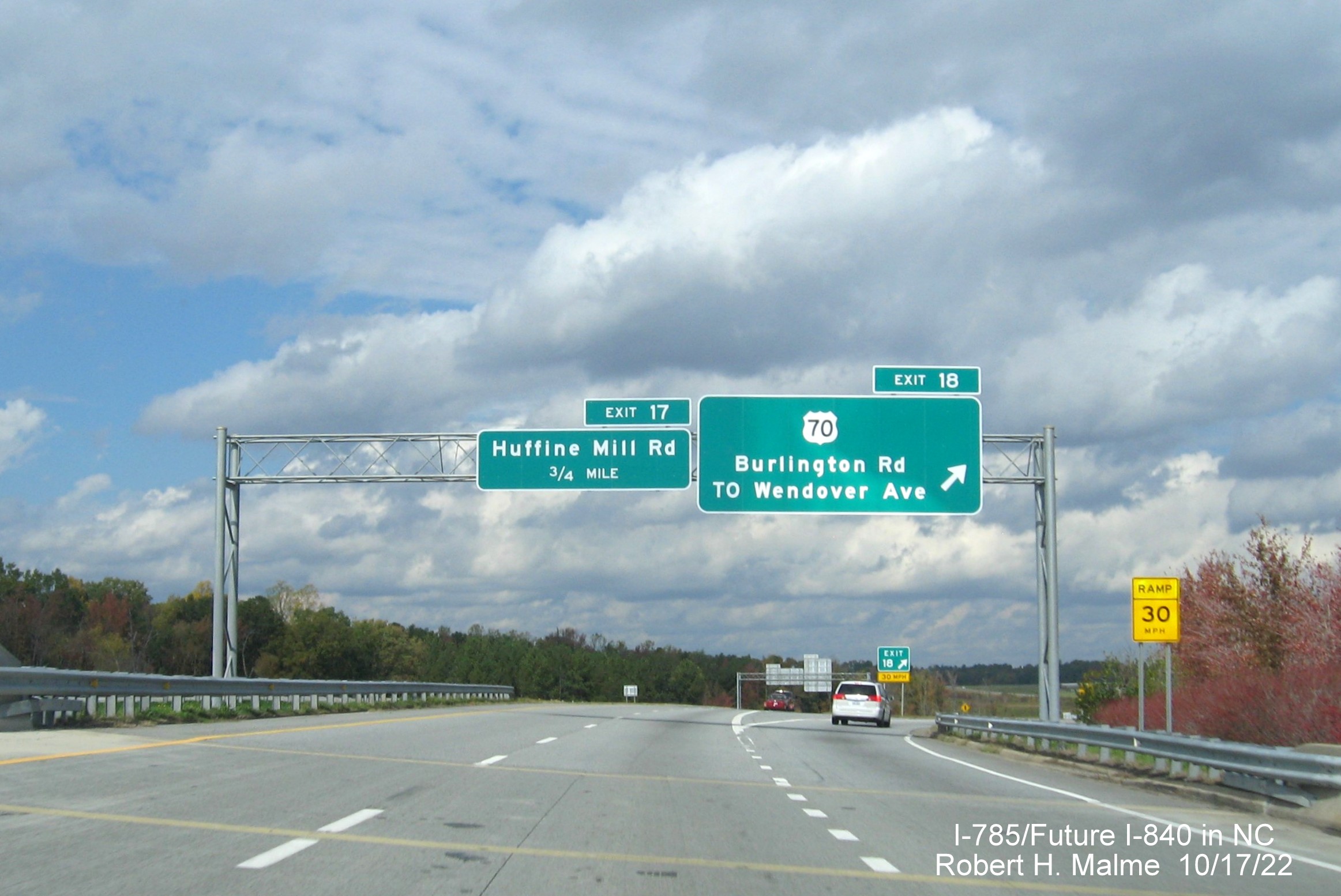 Image of overhead signage at ramp for US 70/Burlington Road exit on I-795 North/Future I-840 West, Greensboro 
                  Urban Loop, October 2022