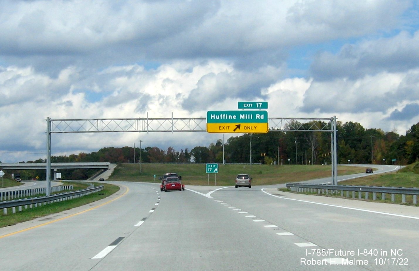 Image of overhead ramp sign for Huffine Mill Road exit on I-785 North/Future I-840 West, Greensboro 
                  Urban Loop, October 2022