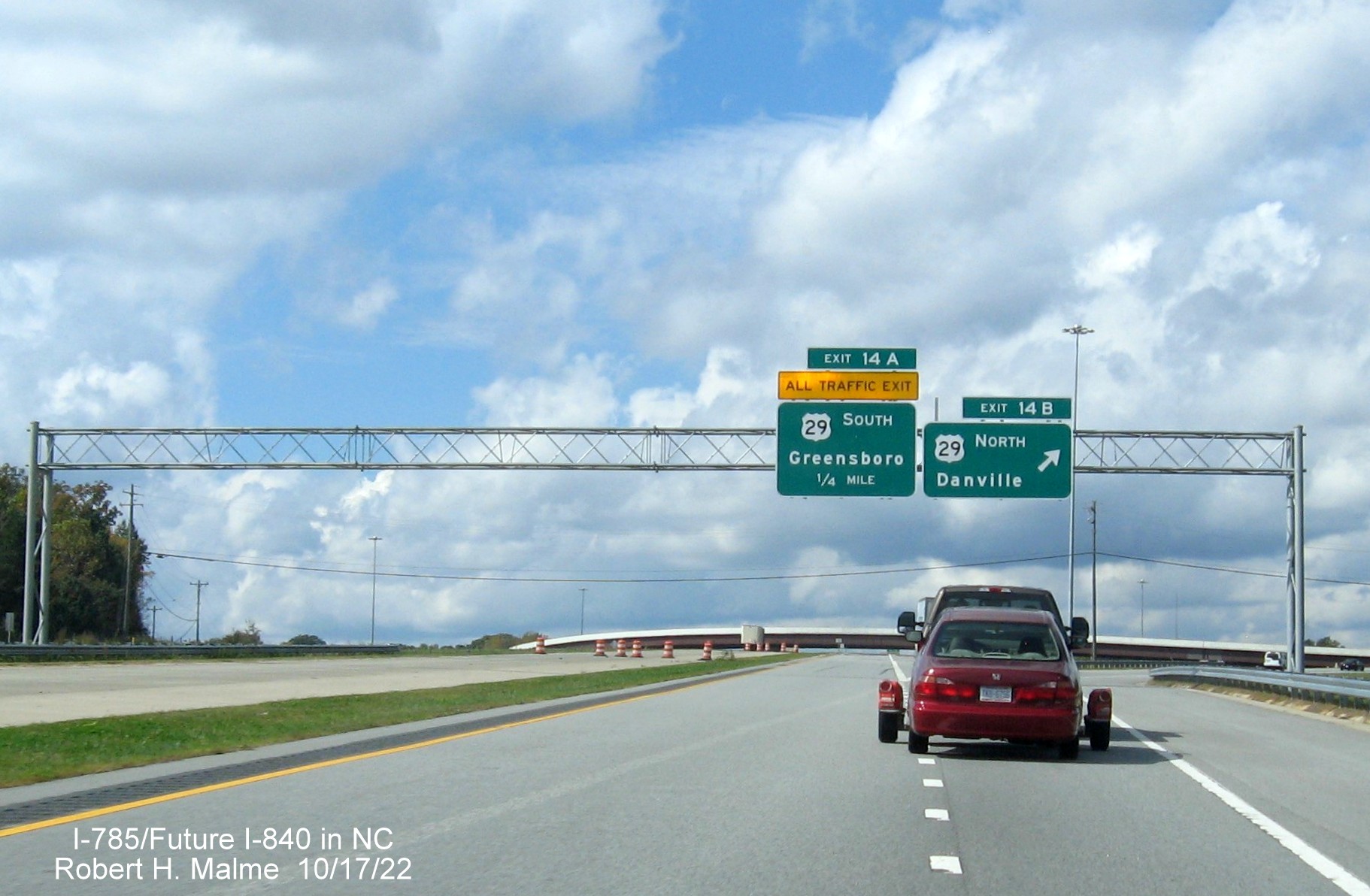 Image of overhead signage for US 29 exits on C/D ramp at current end of Eastern Section of Greensboro 
                  Urban Loop, October 2022