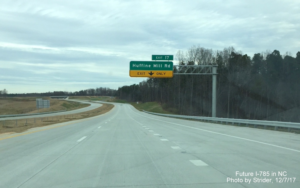 Image of overhead sign for exit only lane approaching Huffine Mill Rd exit on I-785/Greensboro Loop North, by Strider