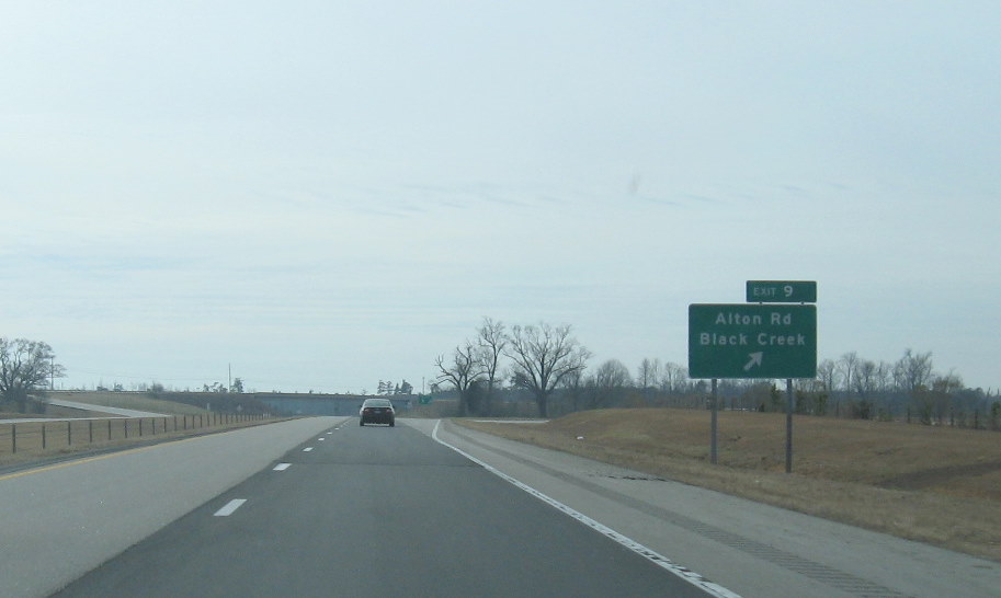 Photo of Alton Road exit signage off of I-795 South showing new Exit number, 
          Jan. 2010