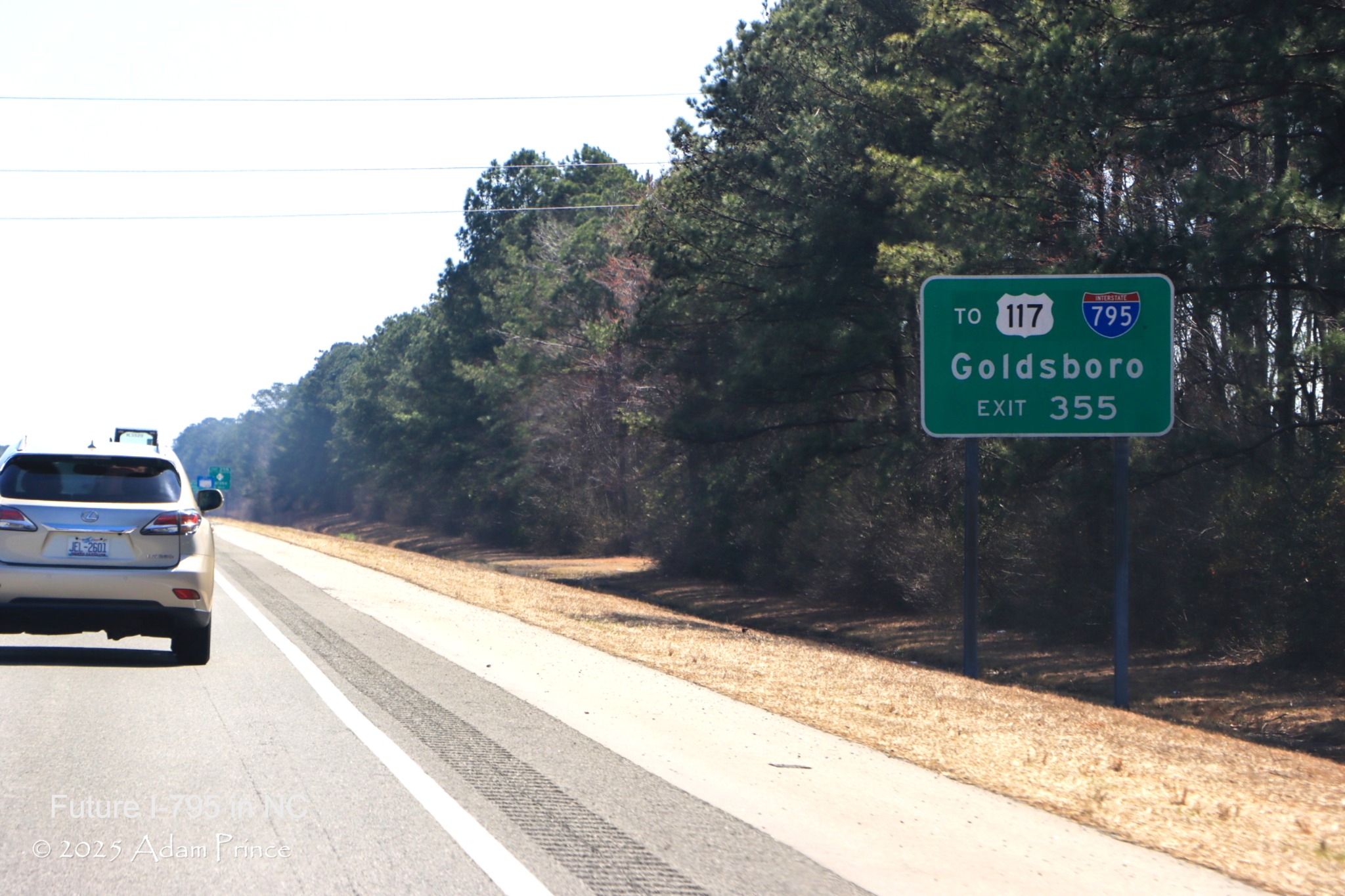 Image of ground mounted auxiliardy sign for NC 403 exit on I-40 East, Adam Prince, 
	  March 2025