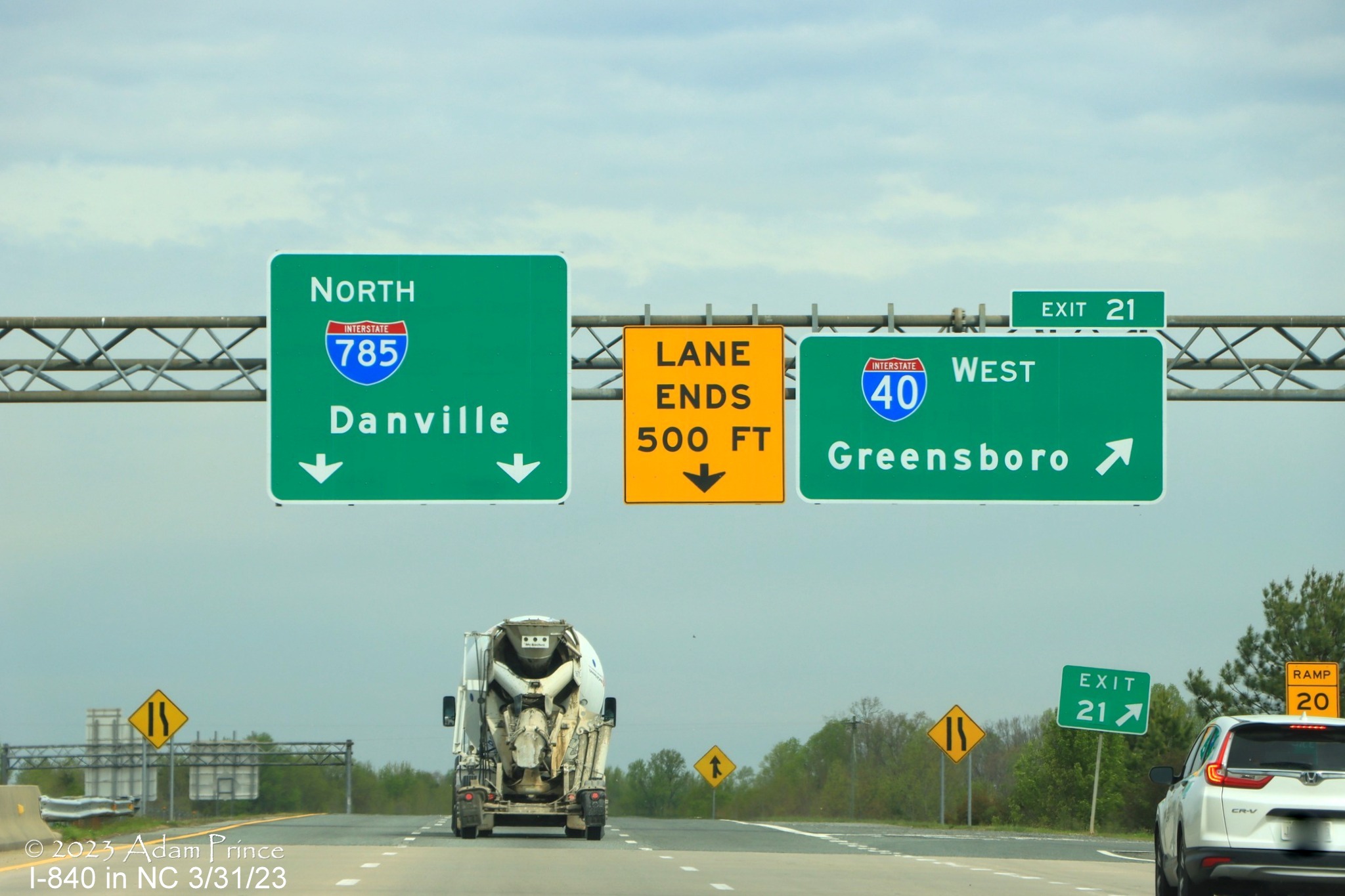 Image of overhead sign for northern section of Greensboro Loop on ramp from I-85 North still missing 
            I-840 shield, Adam Prince,  March 2023