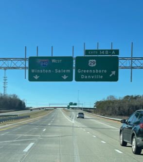 Image of overhead signage at ramp for Yanceyville Street on I-840 West/Greensboro Urban Loop, photo by Strider, January 2023