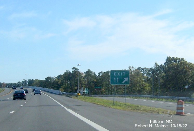 Image of gore sign with new I-885 exit number for Business US 70 West/NC 98 exit on I-885 South/US 70 East
         in Durham, October 2022