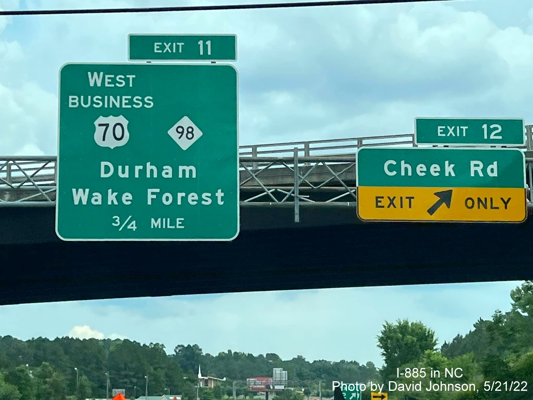 Image of new exit number tabs based on I-885 mileposts for Cheek Road and Business US 70/NC 98 exits on US 70 East
                                          (Future I-885 South) in Durham, by David Johnson, May 2022