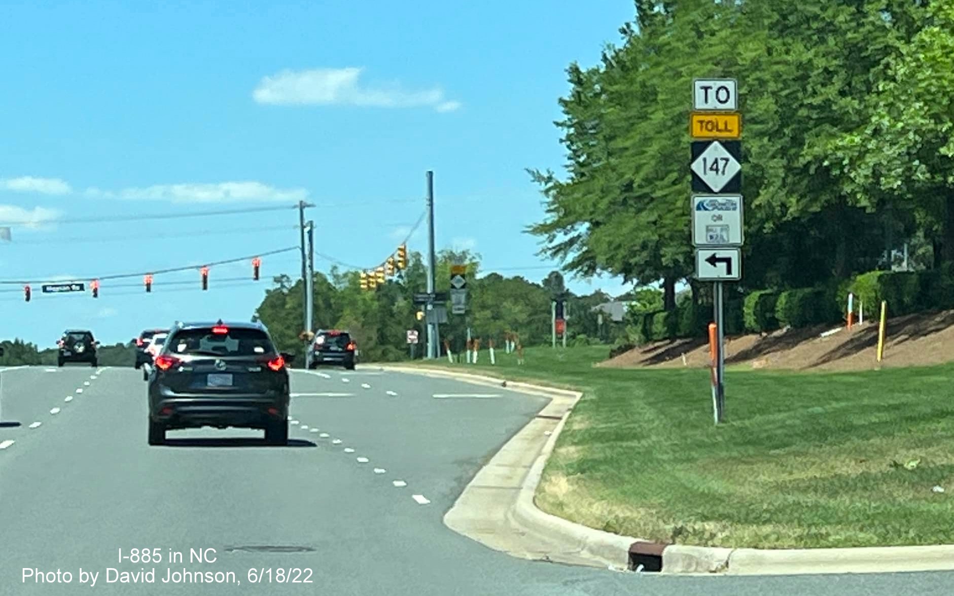 Image of NC 147 shield still standing prior to entrance ramp to Triangle Expressway on Hopson Road in Durham, by David Johnson, June 2022