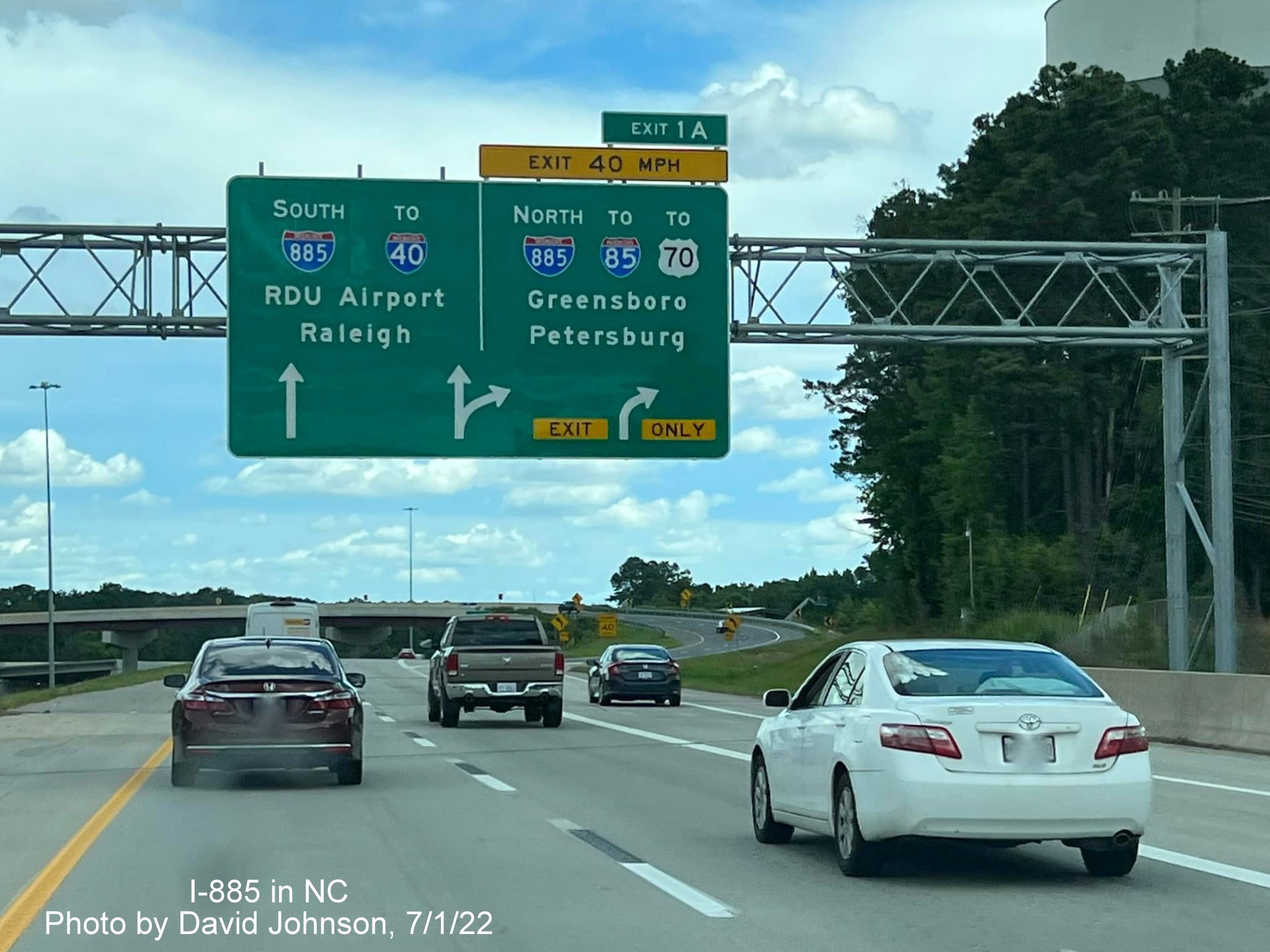 Image of I-885 North exit Arrow-per-lane overhead sign on NC 147 South/Durham Freeway, by David Johnson July 2022