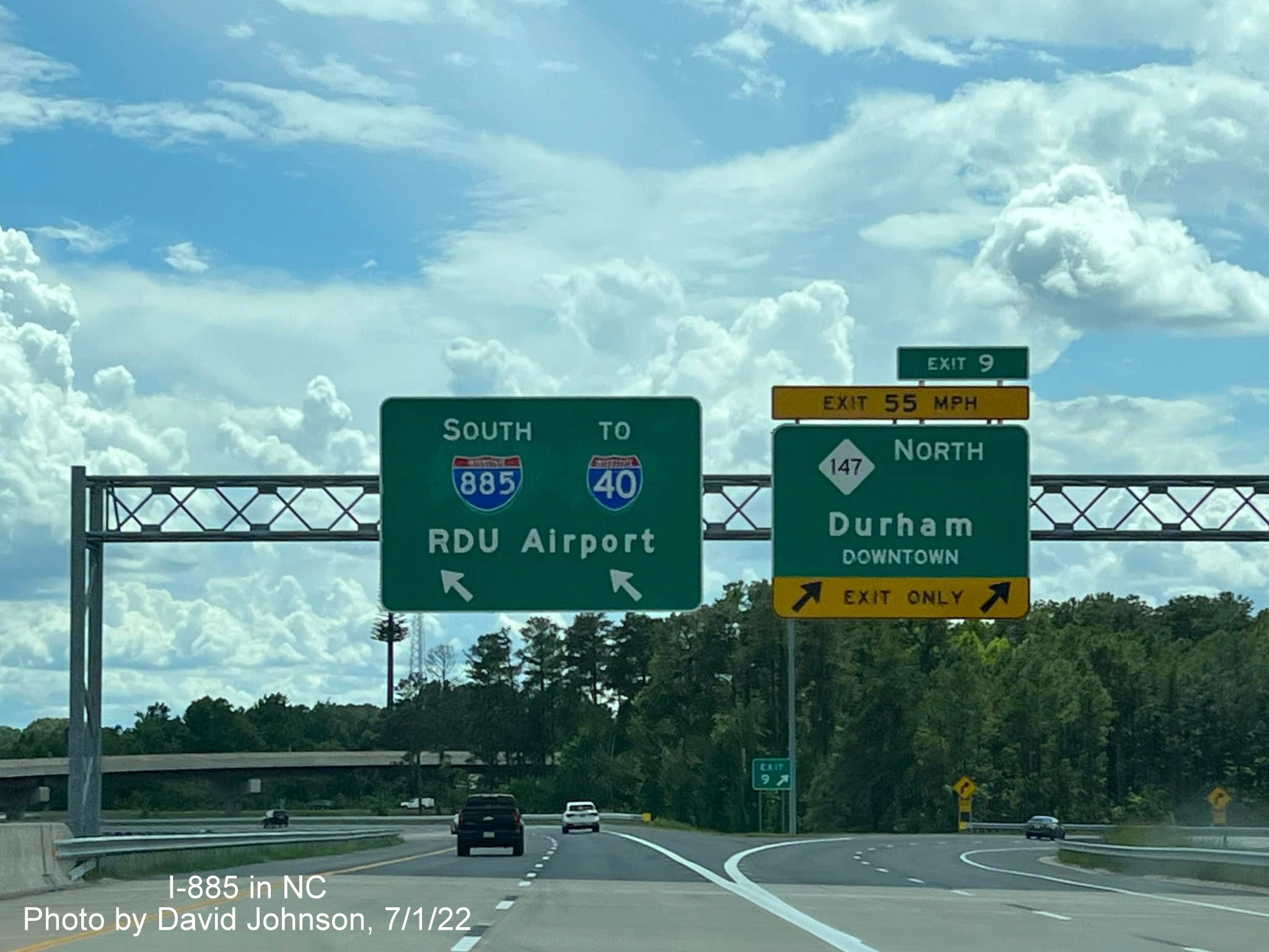 Image of overhead signs for NC 147 exit on East End Connector in Durham, by David Johnson July 2022