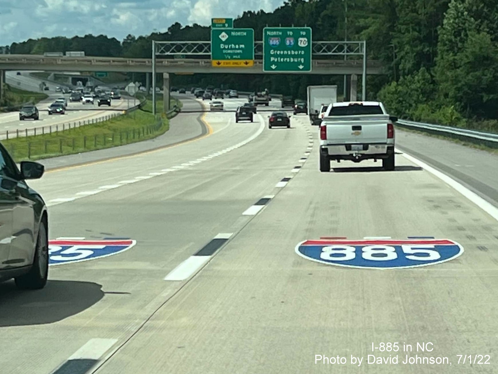 Image of I-885 shields painted onto Durham Freeway north pavement prior to NC 147/Durham Freeway North exit, by David Johnson July 2022