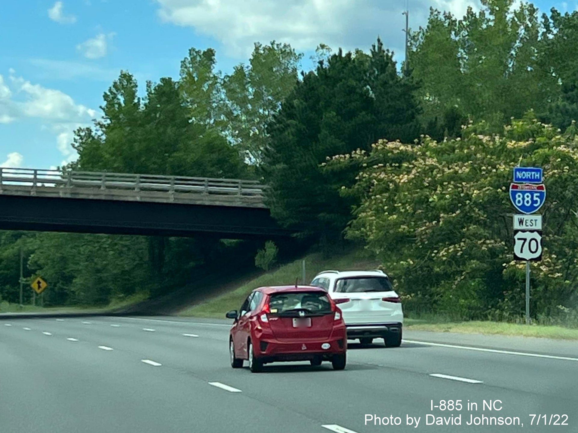 Image of I-885 North/US 70 West reassurance marker after Cheek Road exit, by David Johnson July 2022