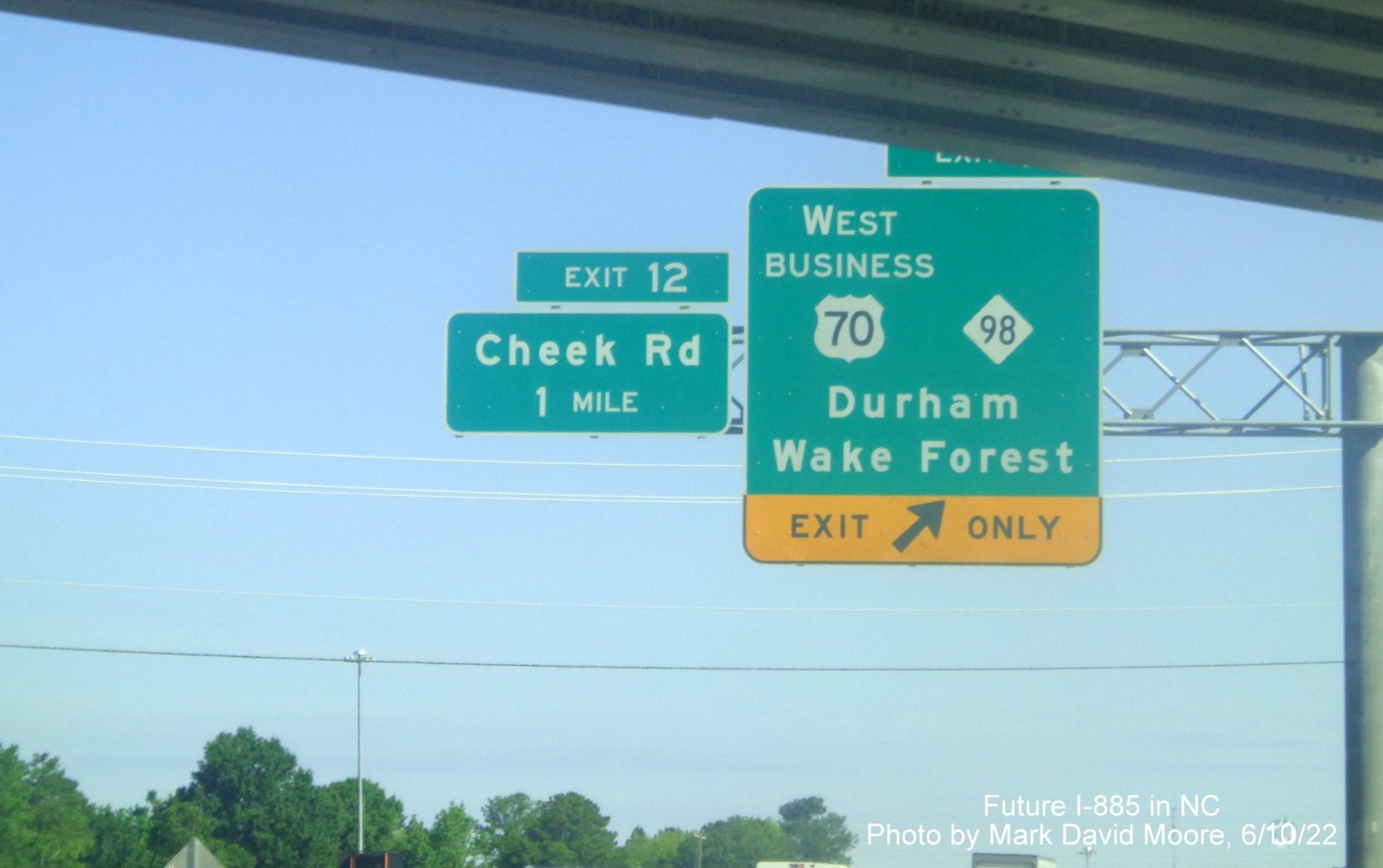 Image of 1 mile advance overhead sign for Cheek Road exit
        on Future I-885 North/US 70 West in Durham, by Mark David Moore June 2022