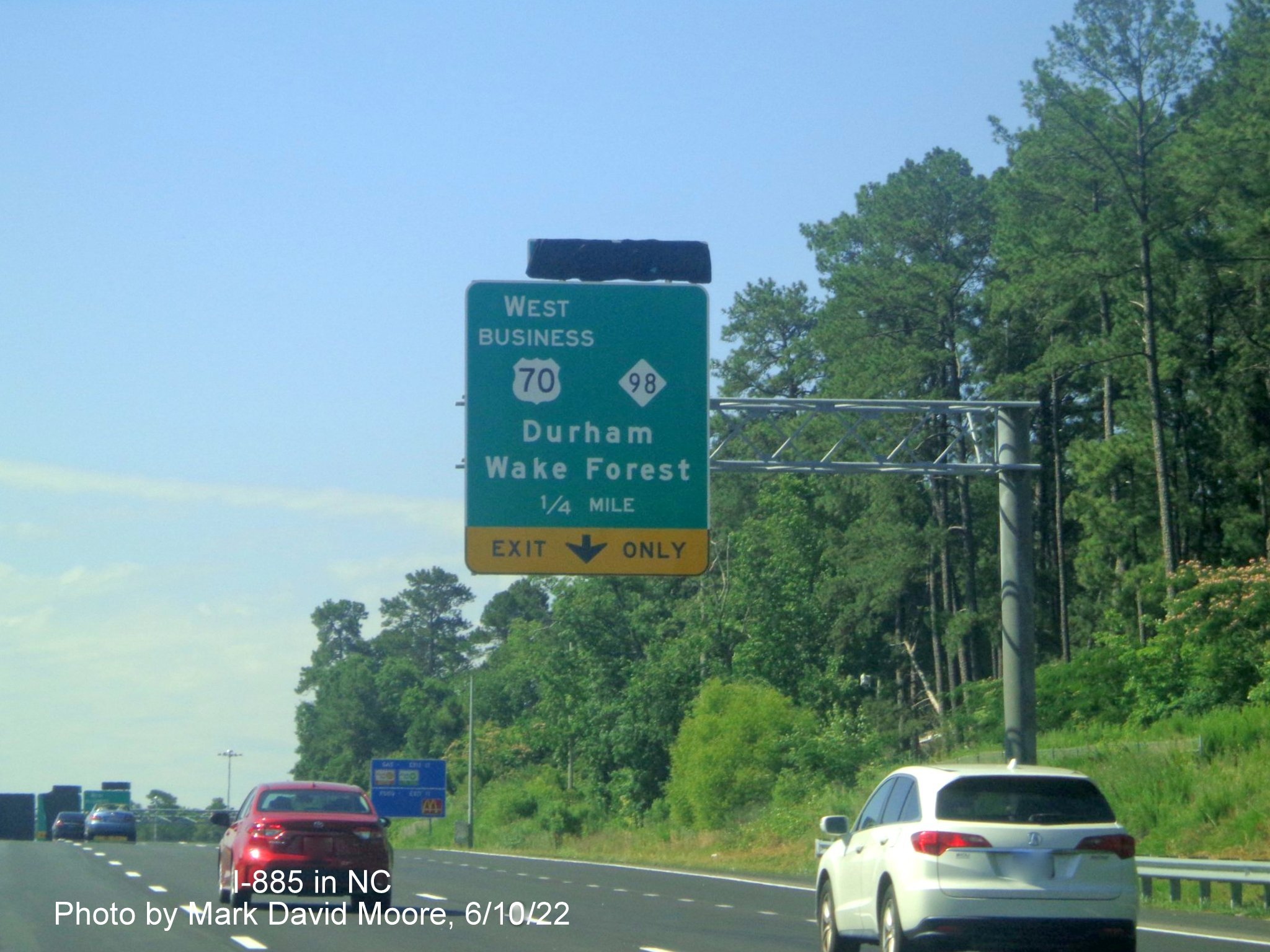 Image of 1/4 mile advance overhead sign for US 70 Bus. West/NC 98 exit
        still covered over on Future I-885 South/US 70 East in Durham, by Mark David Moore June 2022