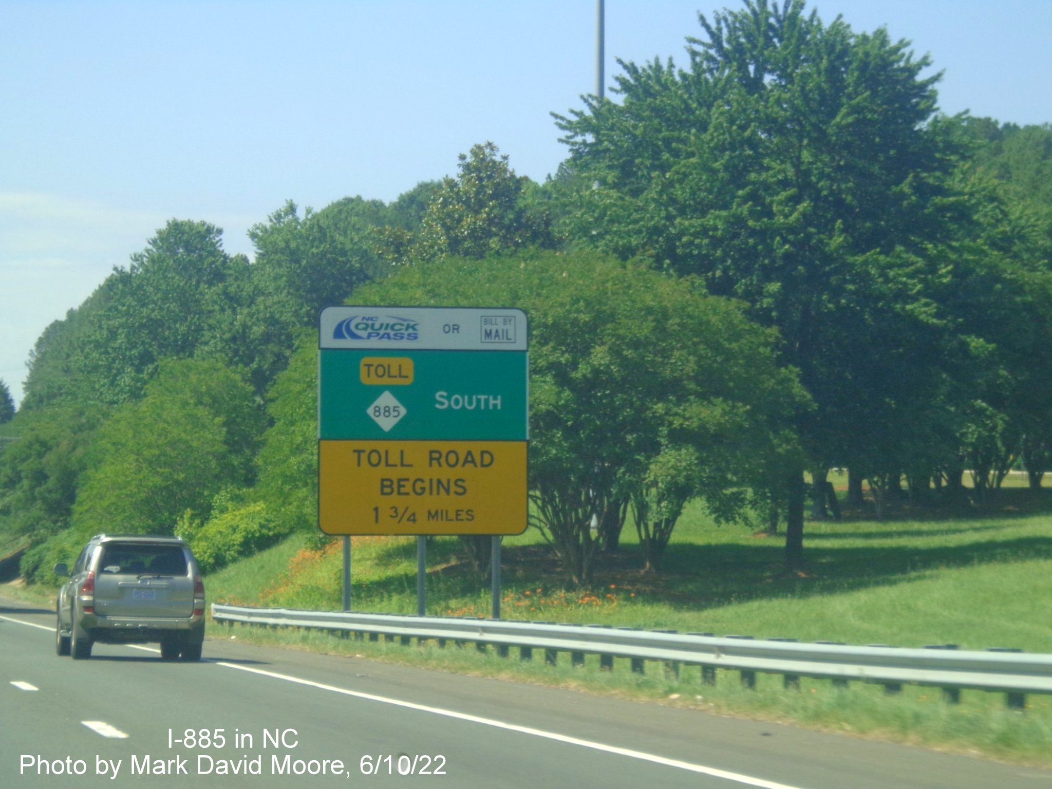 Image of Toll Road advisory sign with new NC 885 shield replacing NC 147
         on the Durham Freeway south at Alexander Drive, by Mark David Moore June 2022
