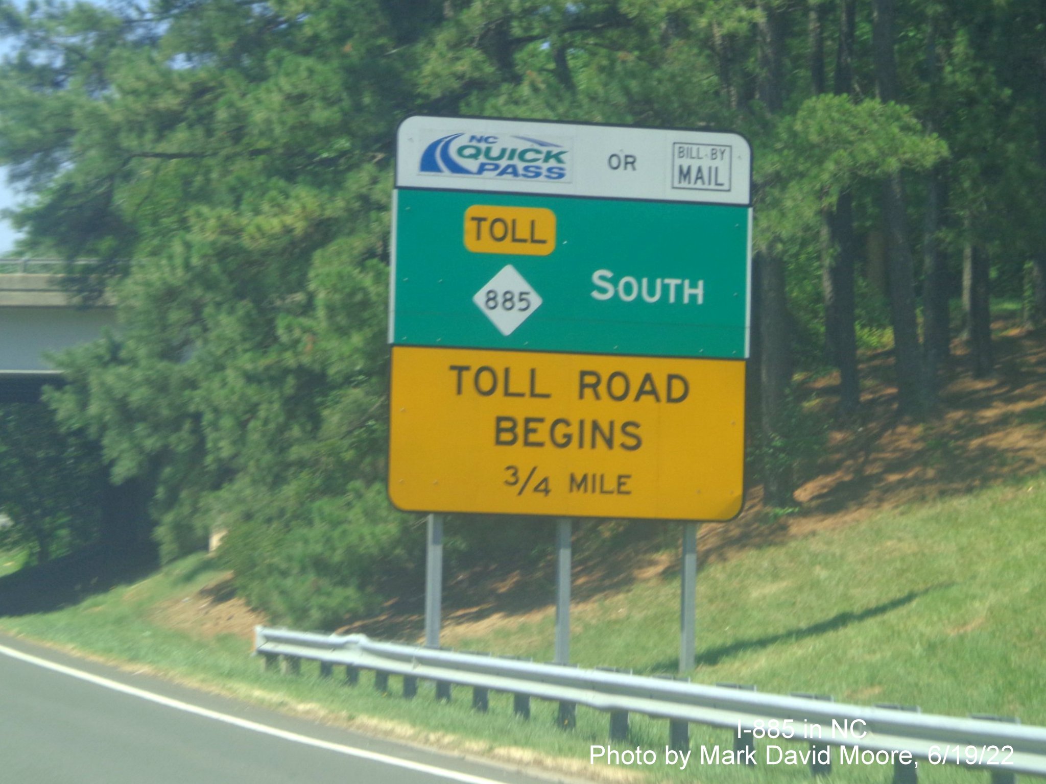Image of Toll Road advisory sign with new NC 885 shield replacing NC 147
         on the Durham Freeway south at Alexander Drive, by Mark David Moore June 2022