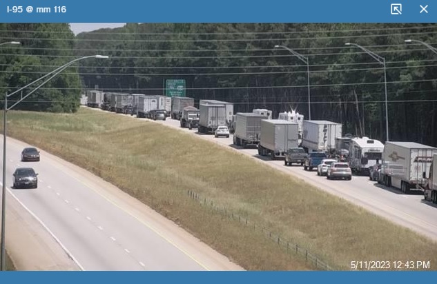 NCDOT traffic camera image showing 1 mile advance sign for US 264/I-795 exit still missing I-587 shield, May 2023