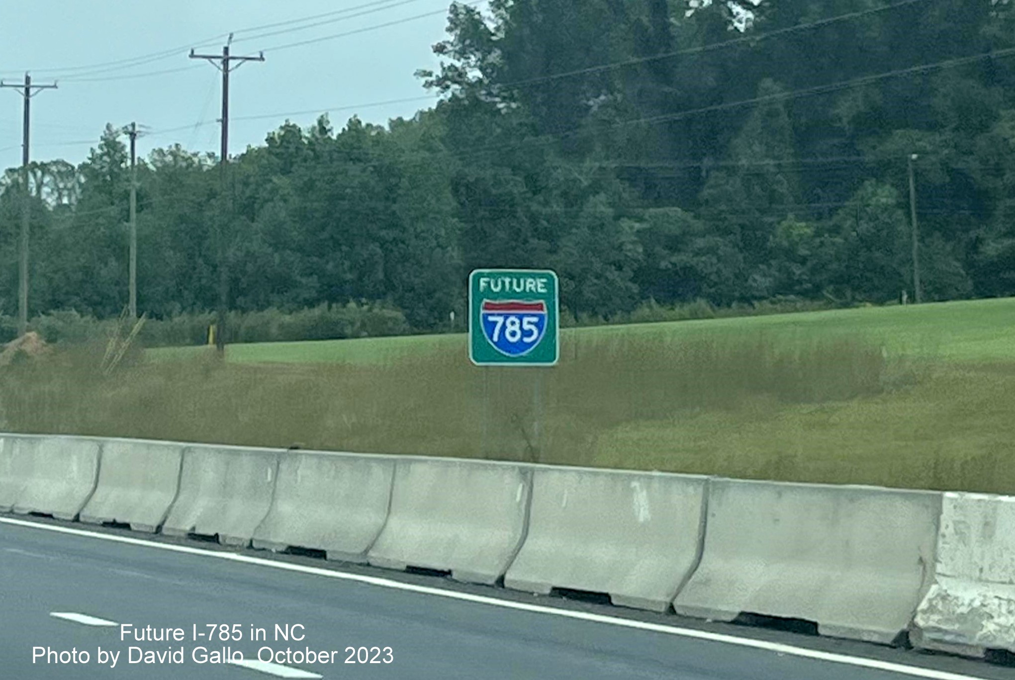 Image of Future I-785 sign behind concrete barrier prior to Reedy Creek Parkway exit, photo by David Gallo, October 2023